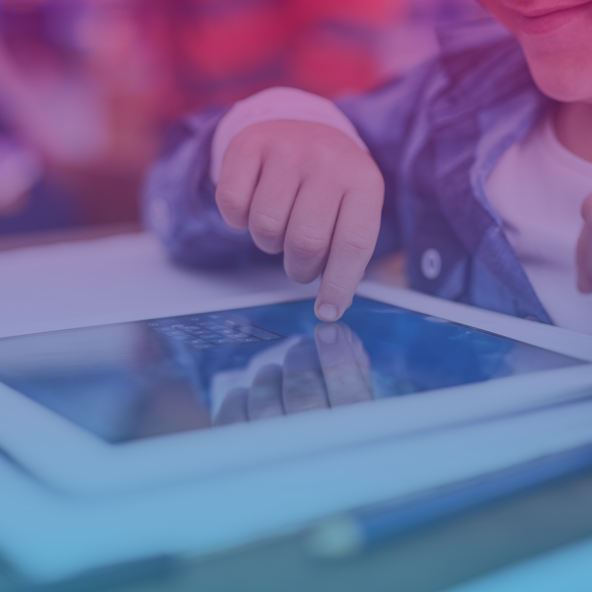 Child using tablet in classroom